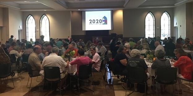 Parishioners gather for a presentation on the 2020 campaign in the parish hall.